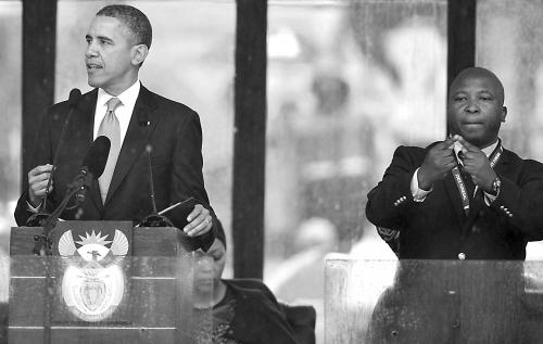 10日,簡特杰為奧巴馬講話作手語翻譯。 10日,簡特杰為奧巴馬講話作手語翻譯。